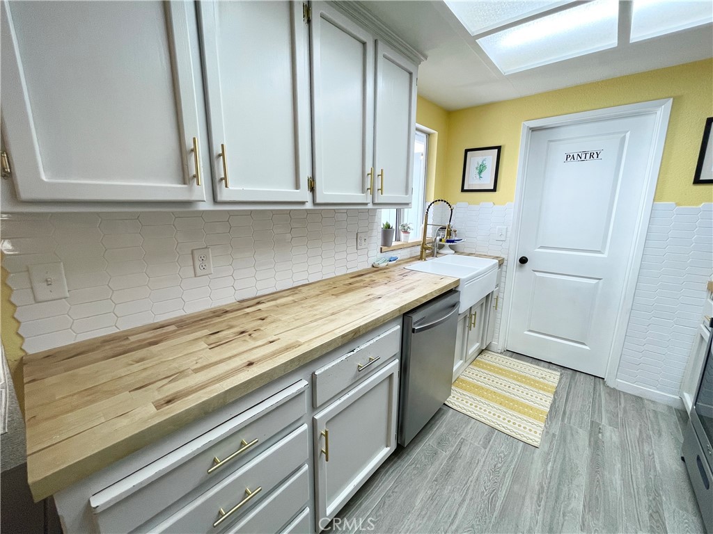 3332 Shamrock Avenue Merced, CA 95340 - Photo 9 of 35 a view of a kitchen with sink and cabinets