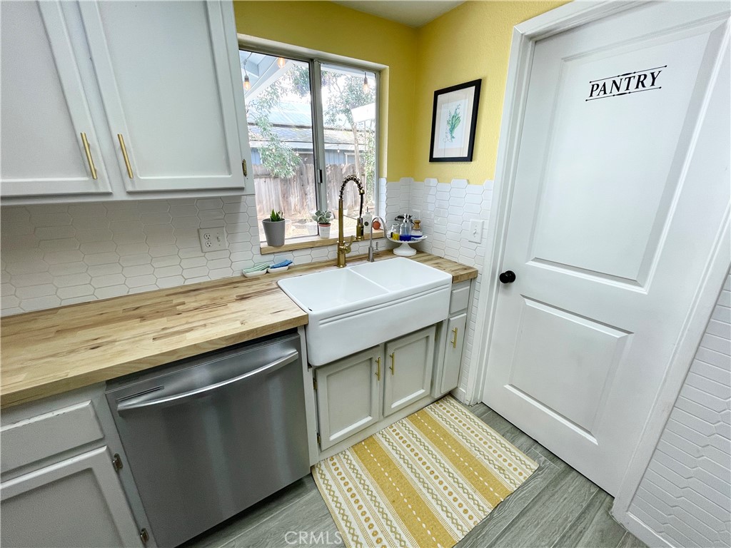 3332 Shamrock Avenue Merced, CA 95340 - Photo 10 of 35 a kitchen with a sink stove and cabinets