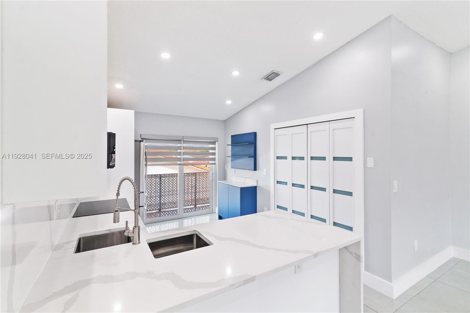 3375 West 76th Street, Unit 210 Hialeah, FL 33018 - Photo 12 of 31 a bedroom with a large bed and a large window