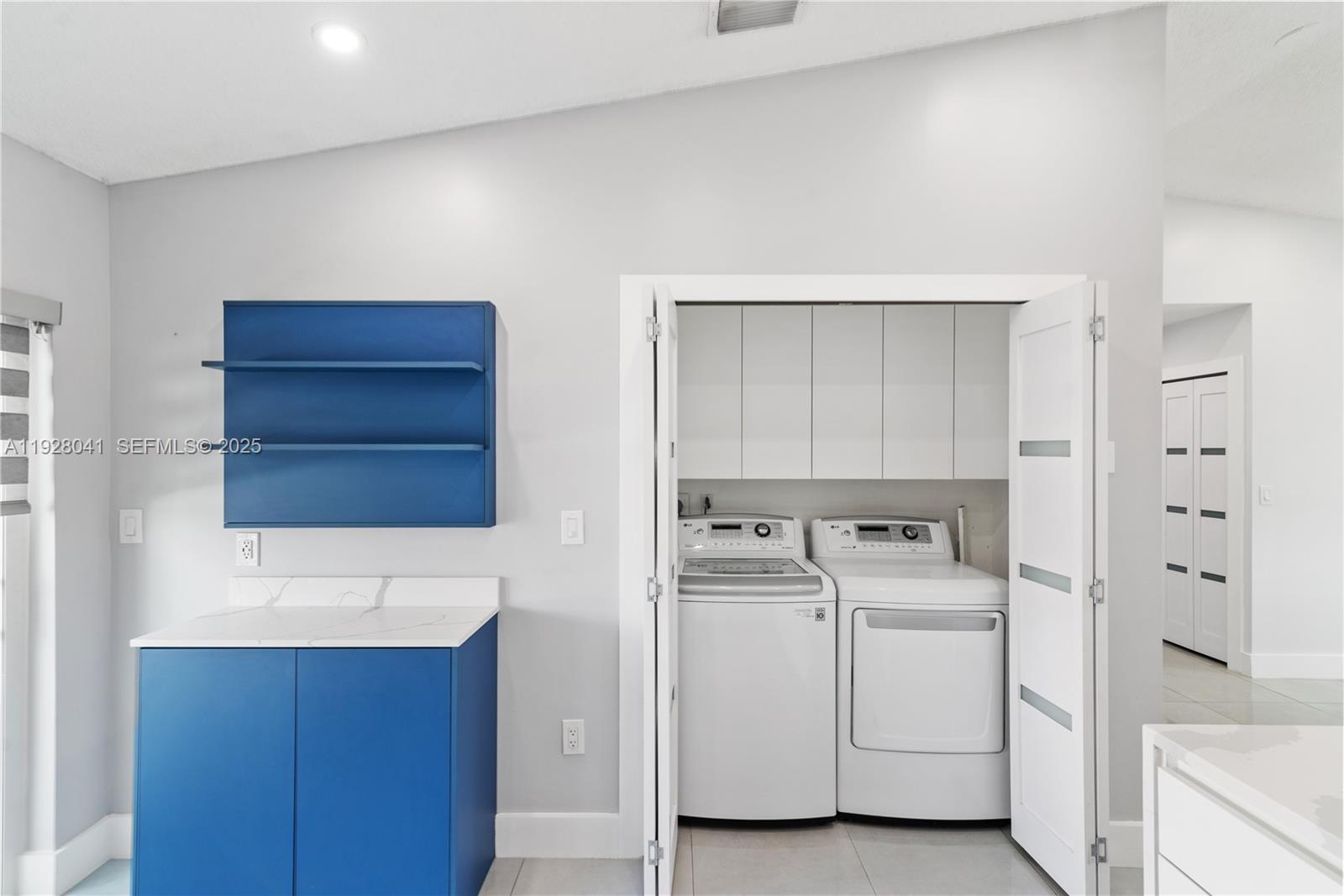 3375 West 76th Street, Unit 210 Hialeah, FL 33018 - Photo 15 of 31 a utility room with cabinets washer and dryer