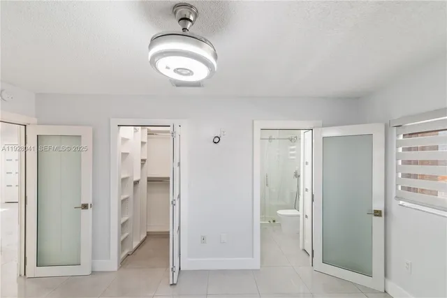a view of wooden floor and windows in a room
