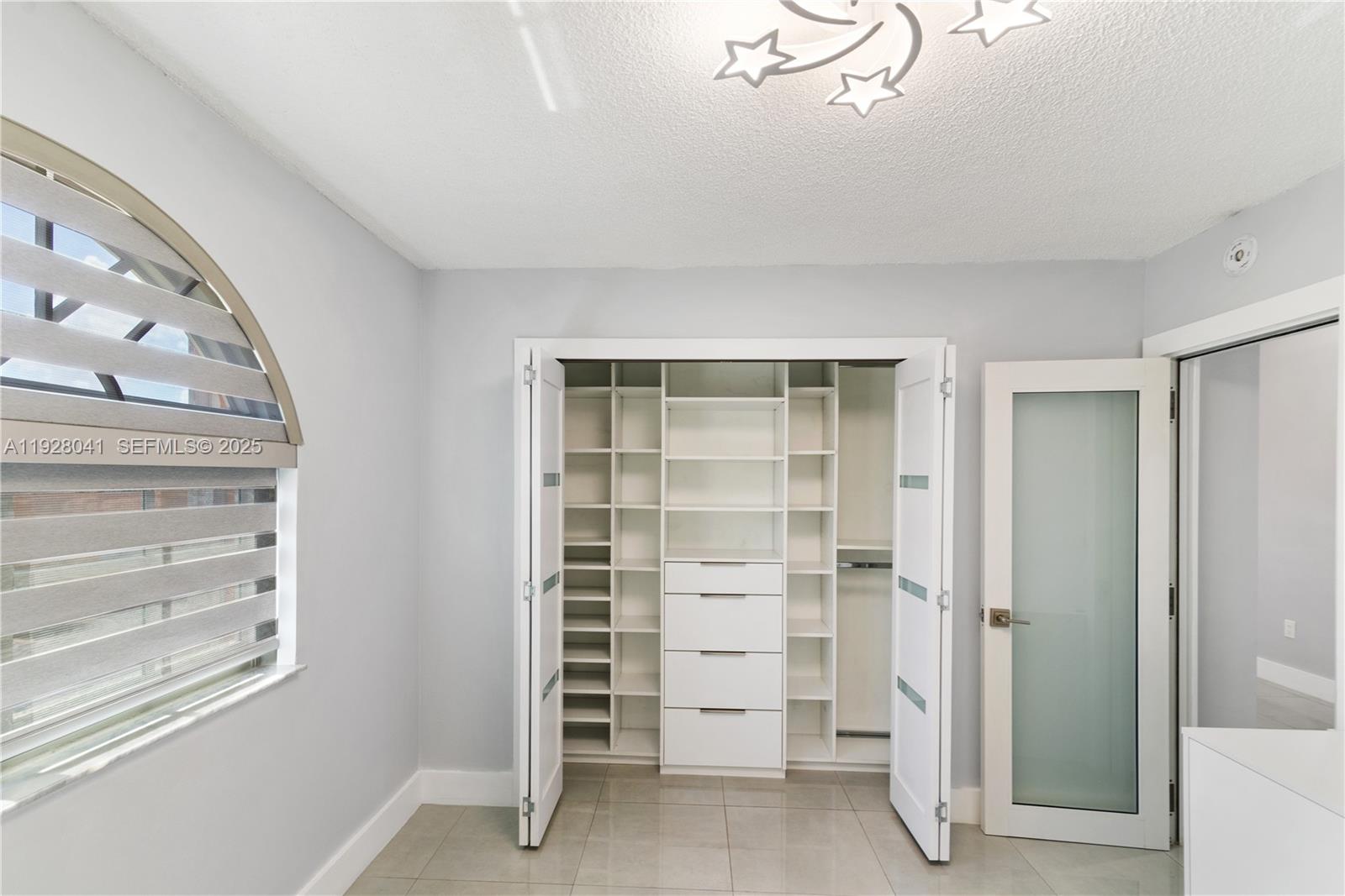 3375 West 76th Street, Unit 210 Hialeah, FL 33018 - Photo 19 of 31 a view of wooden floor and windows in a room