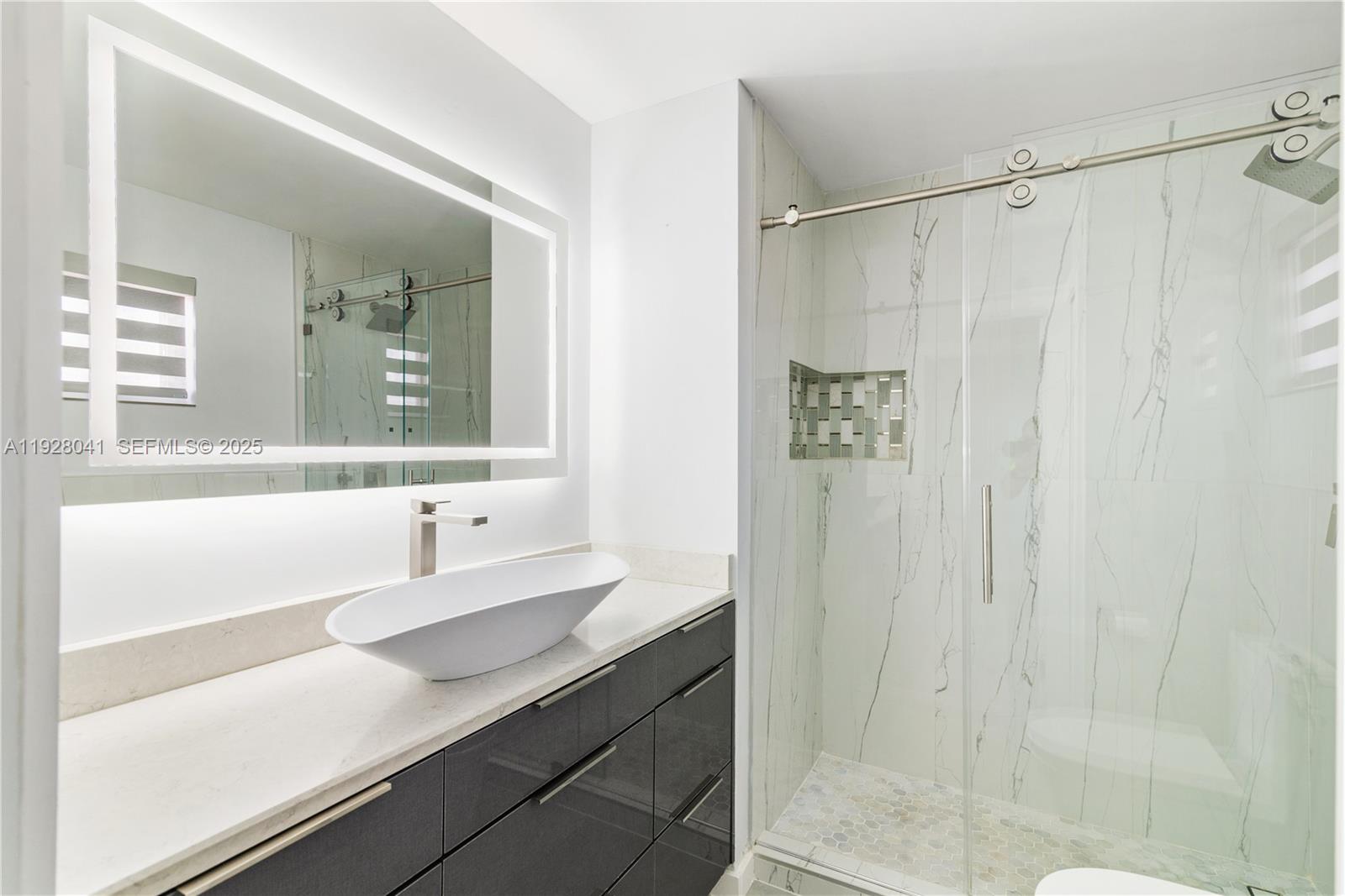 3375 West 76th Street, Unit 210 Hialeah, FL 33018 - Photo 22 of 31 a bathroom with a sink and a mirror