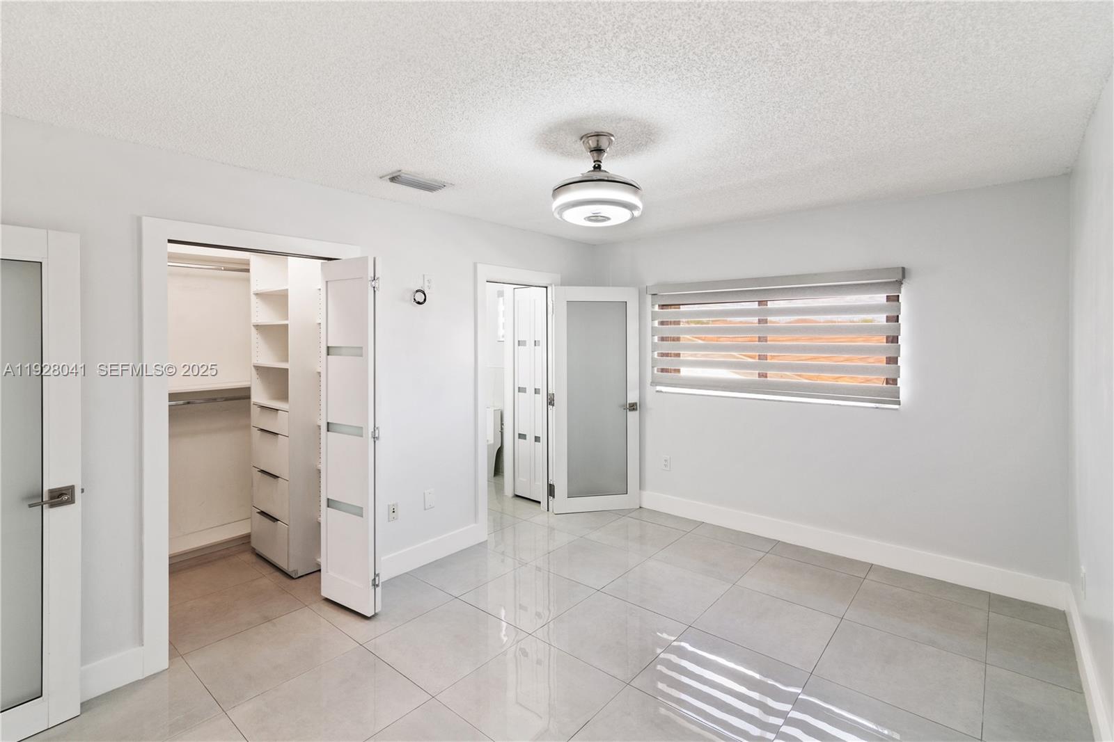 3375 West 76th Street, Unit 210 Hialeah, FL 33018 - Photo 25 of 31 a view of an empty room with a window
