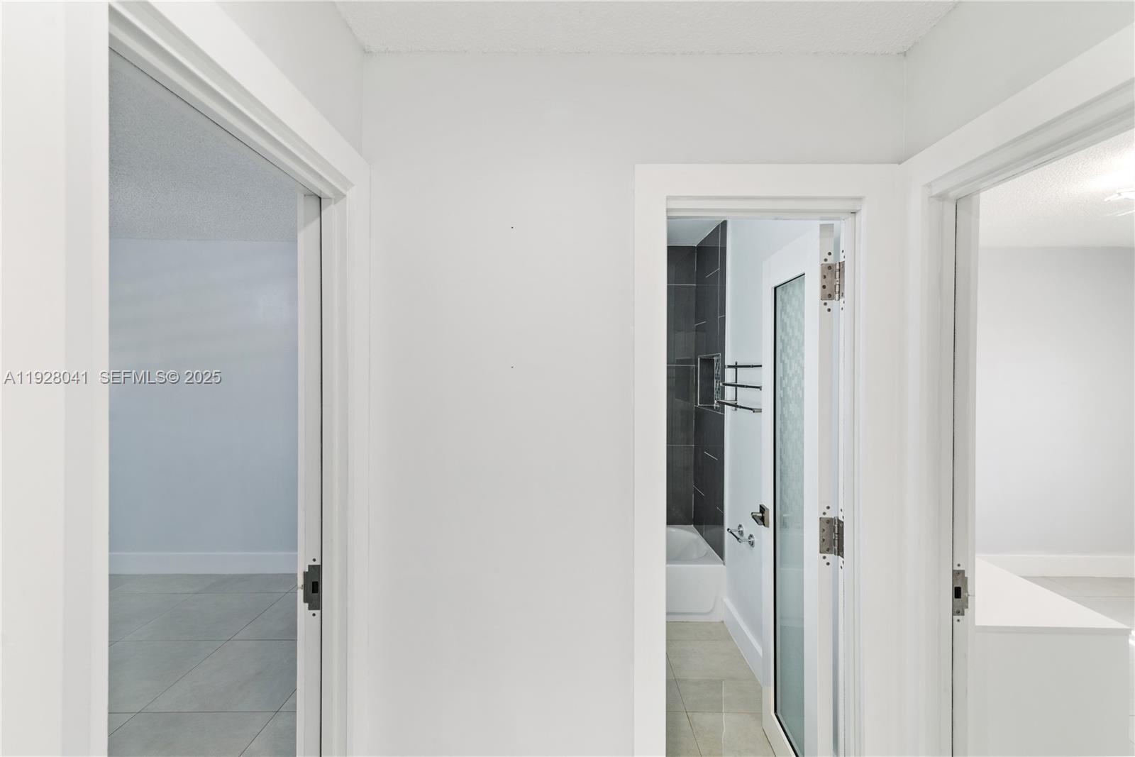 3375 West 76th Street, Unit 210 Hialeah, FL 33018 - Photo 27 of 31 a view of a bathroom from a hallway