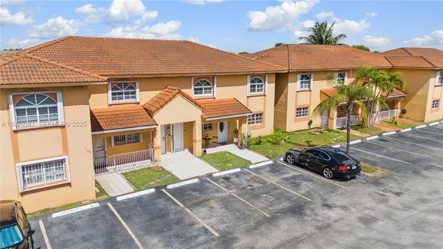 an aerial view of residential houses with outdoor space
