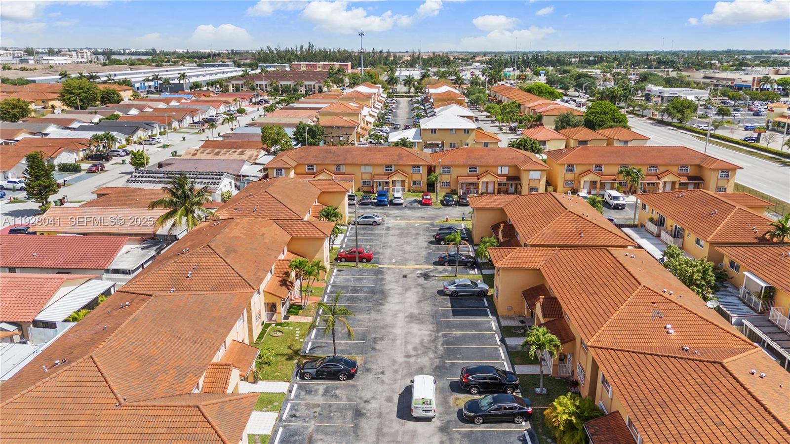 3375 West 76th Street, Unit 210 Hialeah, FL 33018 - Photo 31 of 31 an aerial view of residential houses with outdoor space