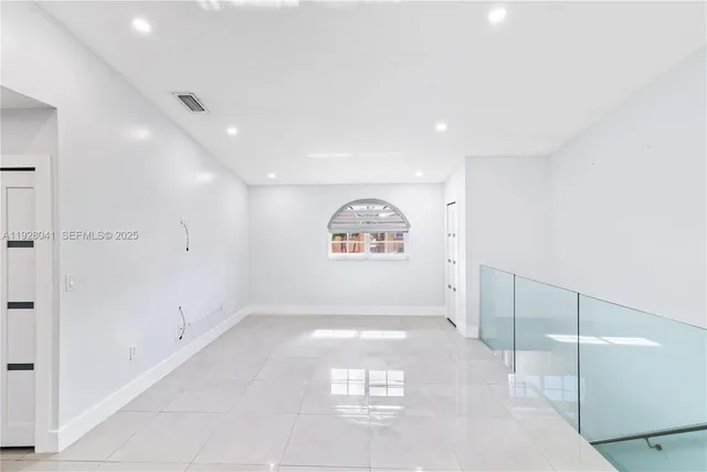 a view of a hallway with a large window