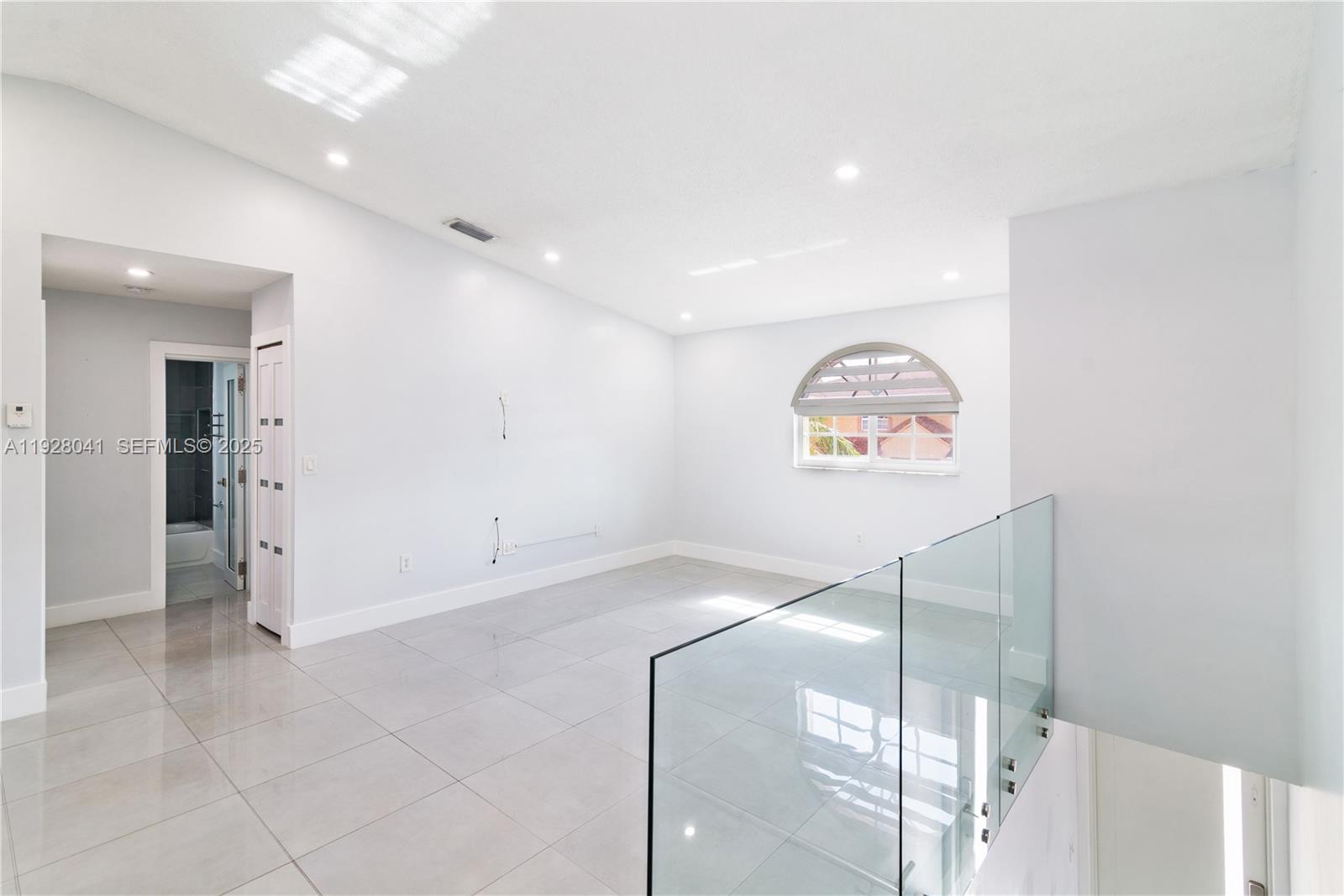 3375 West 76th Street, Unit 210 Hialeah, FL 33018 - Photo 9 of 31 a view of an entryway with wooden floor