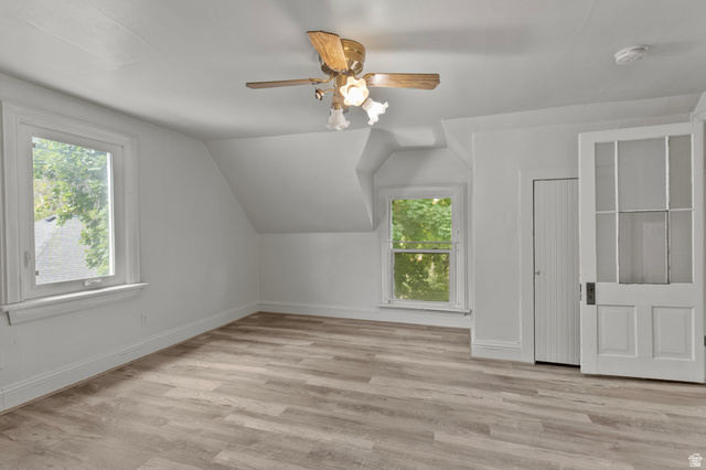 148 South 300 East Logan, UT 84321 - Photo 17 of 29 Room featuring wood-finish flooring, white baseboards, and white walls