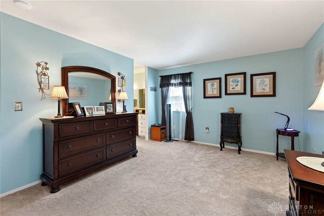 5907 Red Coach Road Dayton, OH 45429 - Photo 26 of 50 This spacious bedroom offers ample natural light and a comfortable, inviting atmosphere.