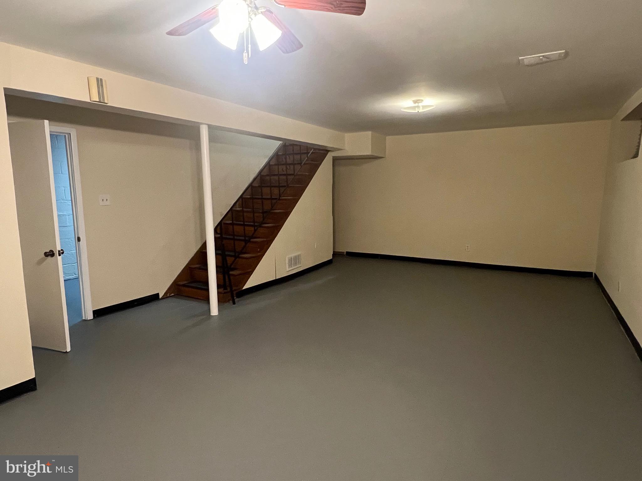 800 Jefferson Street Northeast Washington, DC 20011 - Photo 14 of 17 an empty room with a ceiling fan and windows