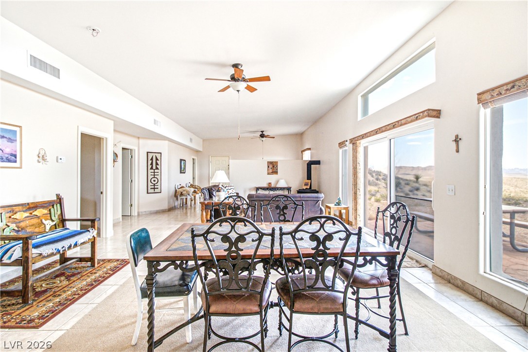 Rocking S Ranch Road Searchlight, NV 89046 - Photo 22 of 47 An open-concept living space with tiled floors and views of the desert landscape.