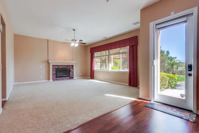 a view of a bathroom with toilet wooden floor and bathroom
