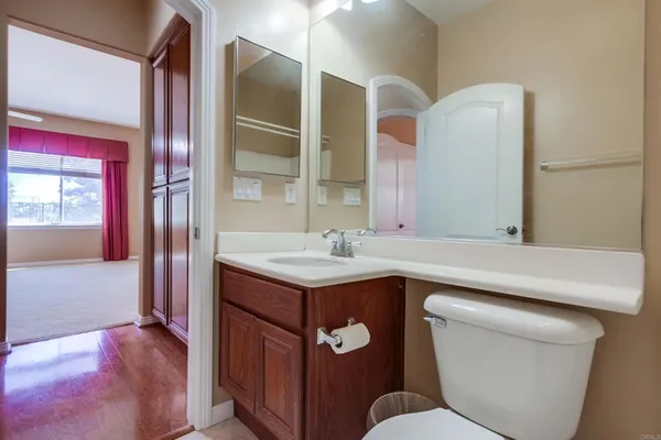 a view of an entryway with wooden floor