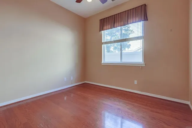 a spacious bathroom with a double vanity sink and a mirror