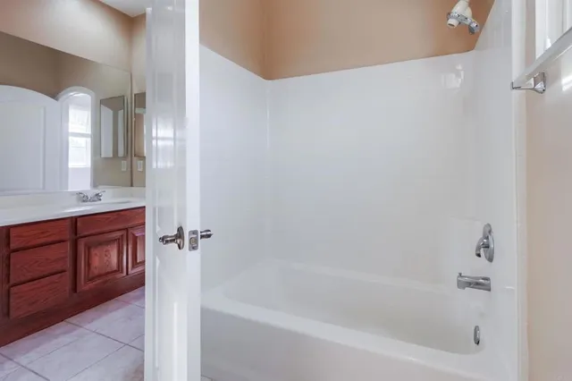 an empty room with a empty space and windows