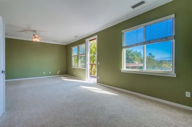 an aerial view of multiple houses with a yard