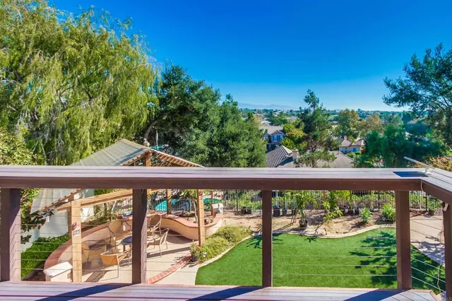 a view of a park with large trees