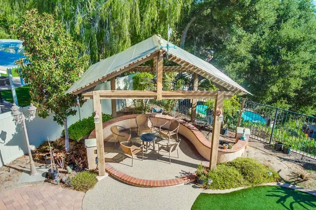 a view of a grassy field with an trees