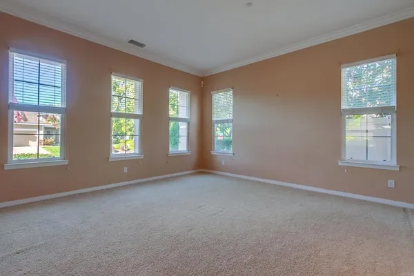 a large kitchen with stainless steel appliances kitchen island granite countertop a large counter top space and cabinets