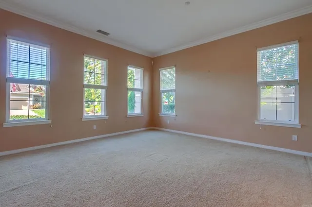 a large kitchen with stainless steel appliances kitchen island granite countertop a large counter top space and cabinets