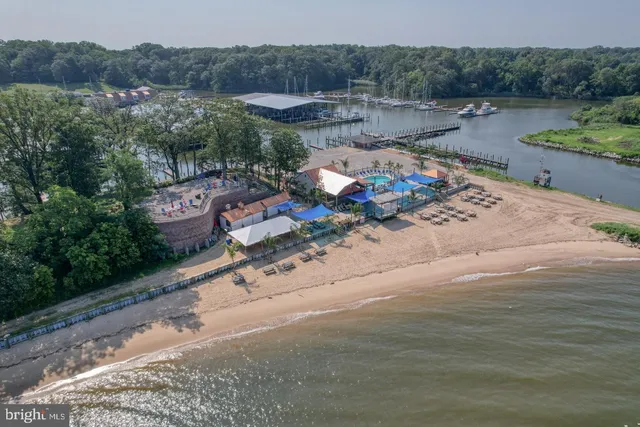 an aerial view of a residential houses with outdoor space