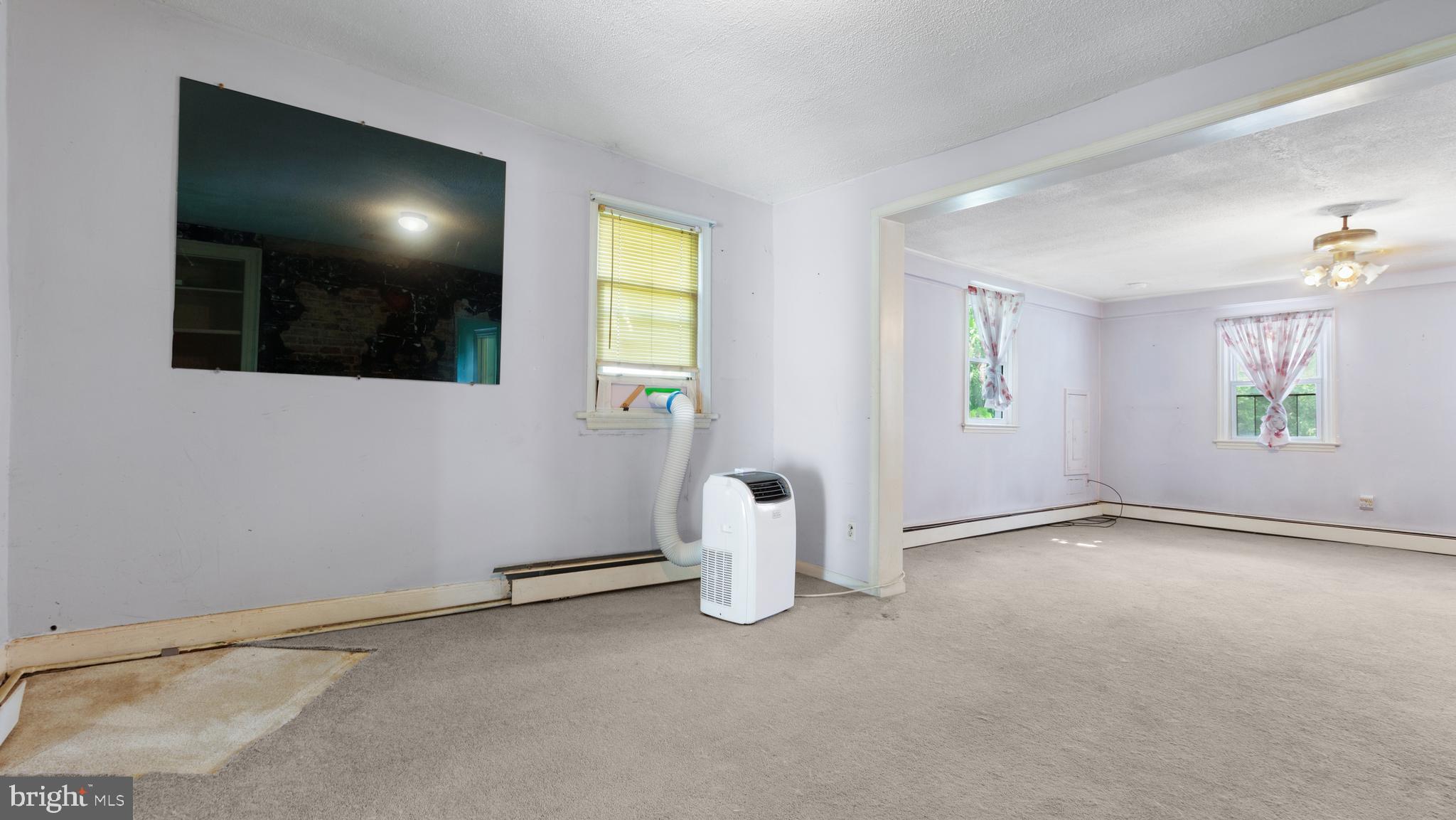 2207 Floral Park Road Clinton, MD 20735 - Photo 18 of 46 wooden floor in an empty room with a window
