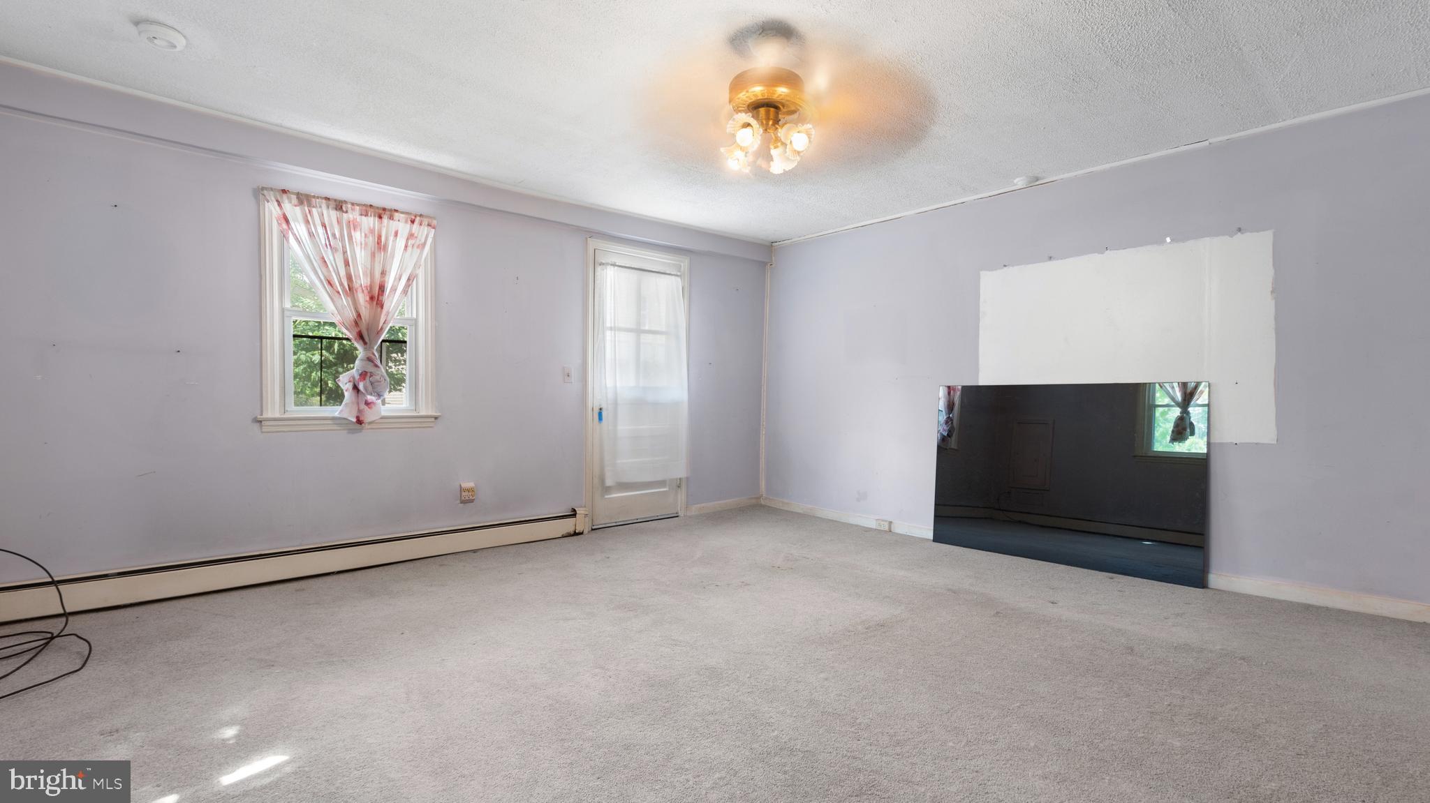 2207 Floral Park Road Clinton, MD 20735 - Photo 19 of 46 an empty room with windows and fan