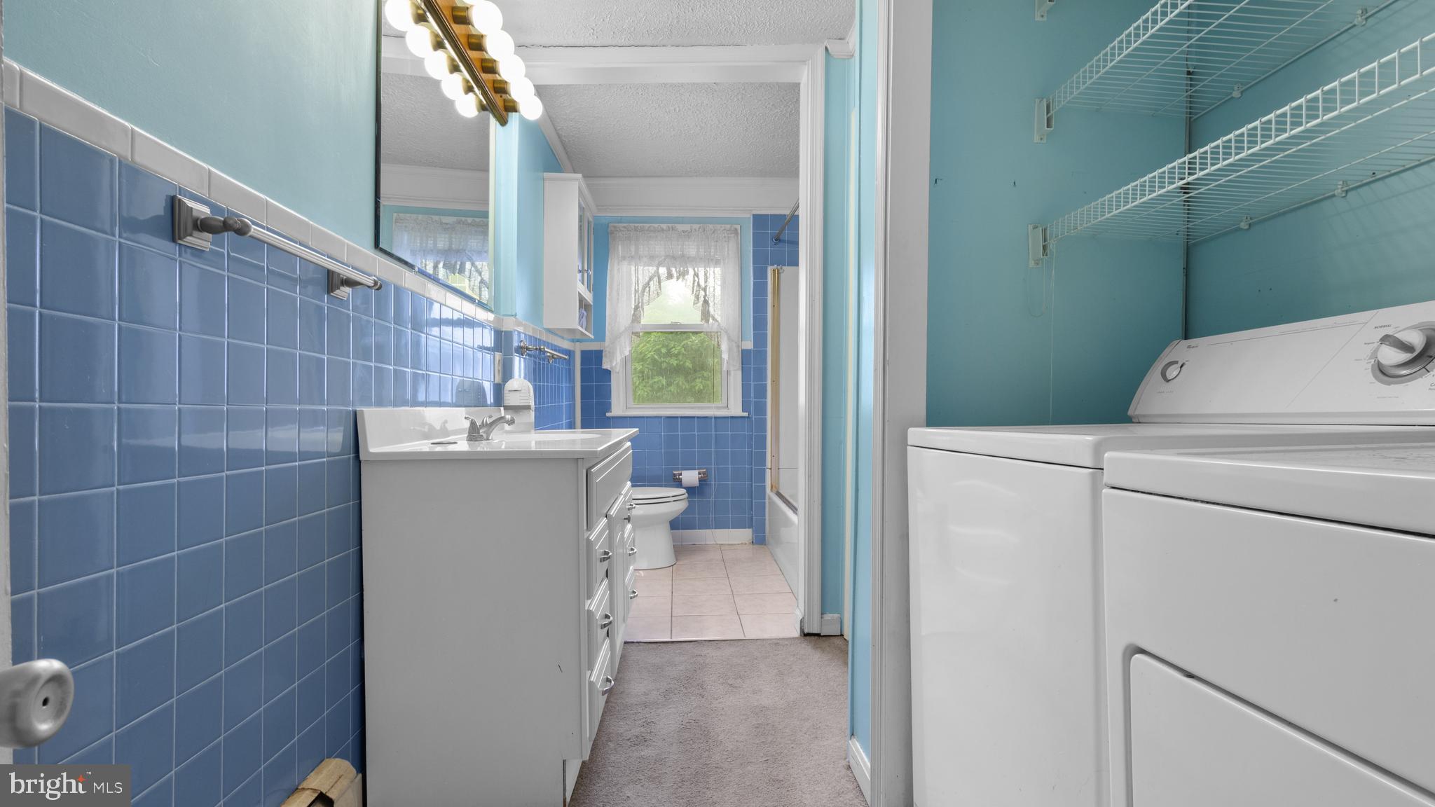 2207 Floral Park Road Clinton, MD 20735 - Photo 23 of 46 a utility room with dryer and washer
