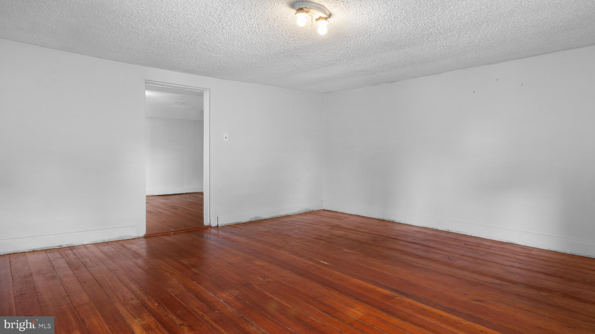 2207 Floral Park Road Clinton, MD 20735 - Photo 30 of 46 a view of an empty room with wooden floor