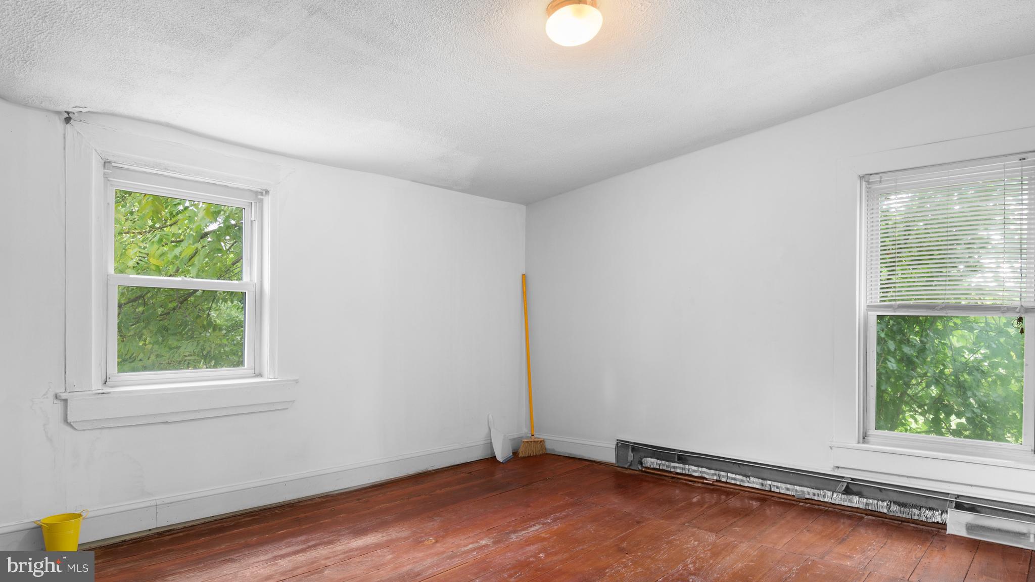 2207 Floral Park Road Clinton, MD 20735 - Photo 31 of 46 an empty room with wooden floor and windows