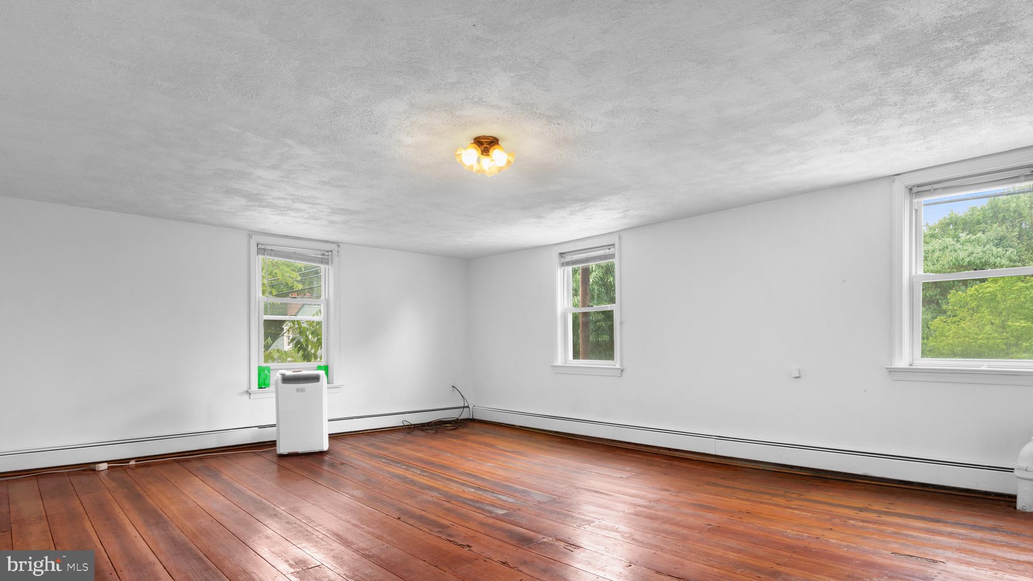 2207 Floral Park Road Clinton, MD 20735 - Photo 34 of 46 an empty room with wooden floor and a window