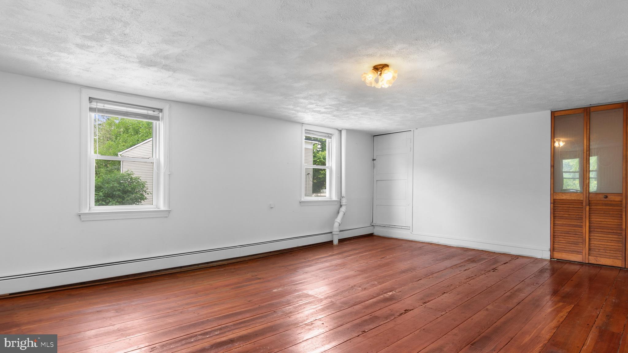 2207 Floral Park Road Clinton, MD 20735 - Photo 35 of 46 a view of an empty room with wooden floor and a window