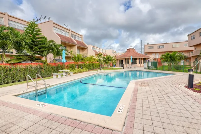a view of swimming pool from a balcony