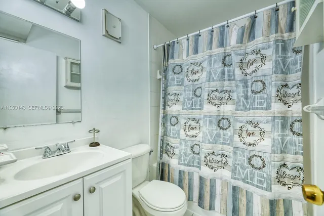 a bathroom with a sink and toilet