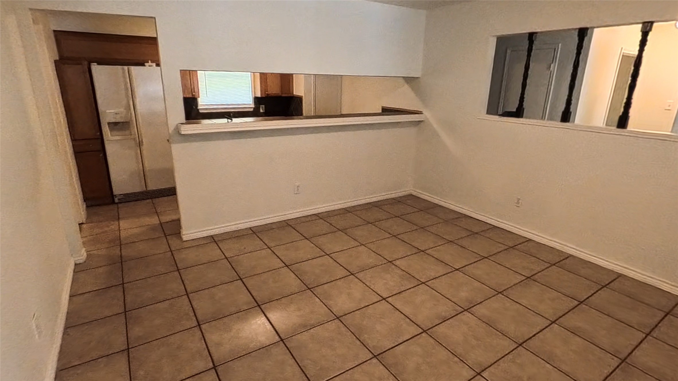 3327 Valerie Lane Spring, TX 77380 - Photo 4 of 11 a kitchen with a sink and refrigerator