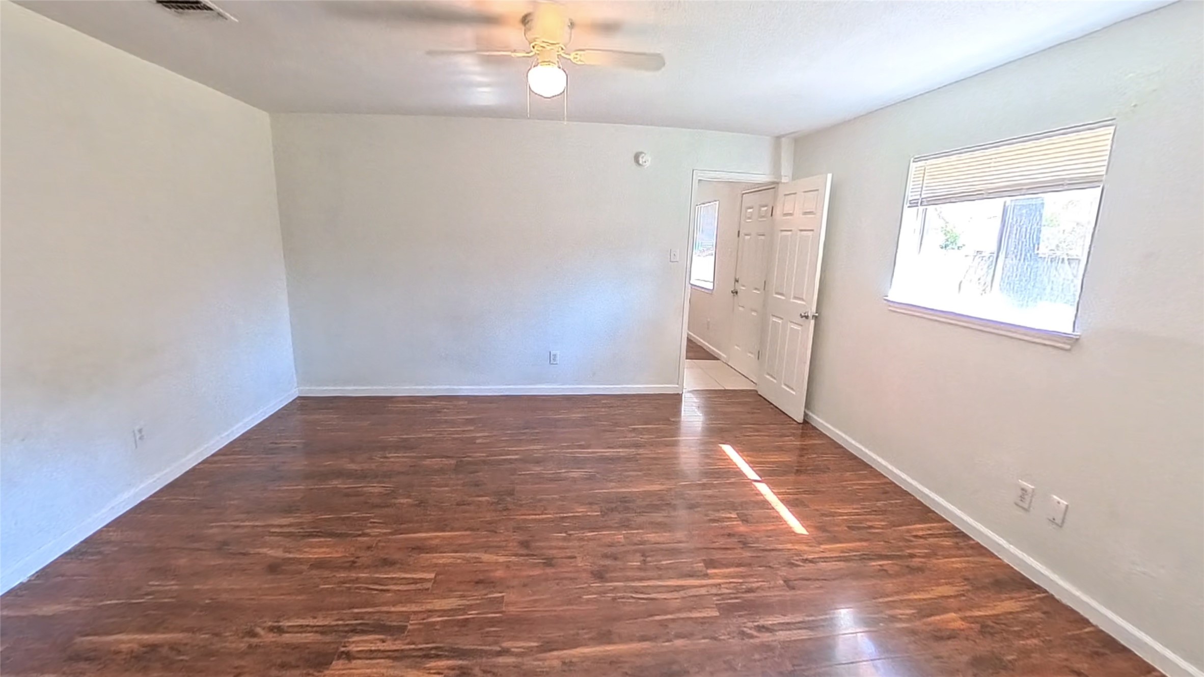3327 Valerie Lane Spring, TX 77380 - Photo 6 of 11 wooden floor in an empty room with a window