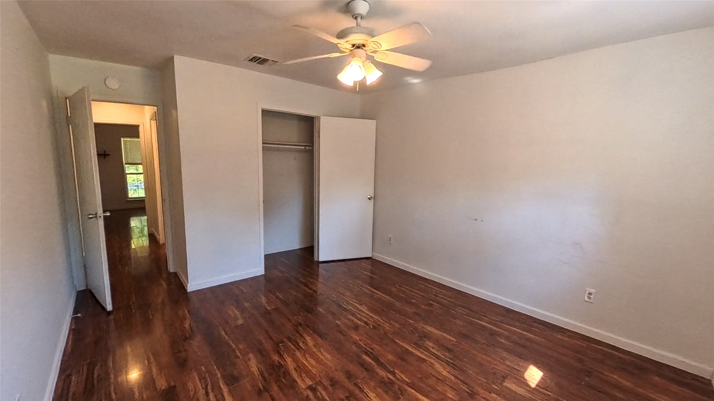 3327 Valerie Lane Spring, TX 77380 - Photo 8 of 11 wooden floor in an empty room with a window