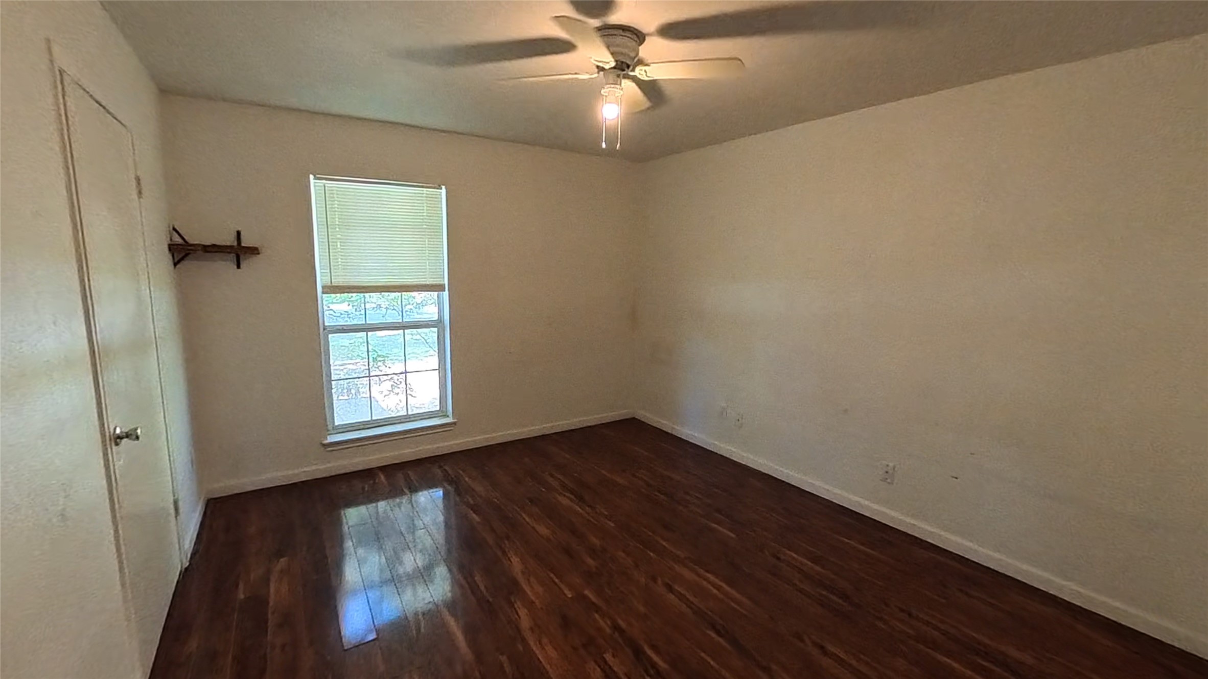 3327 Valerie Lane Spring, TX 77380 - Photo 9 of 11 wooden floor in an empty room with a window