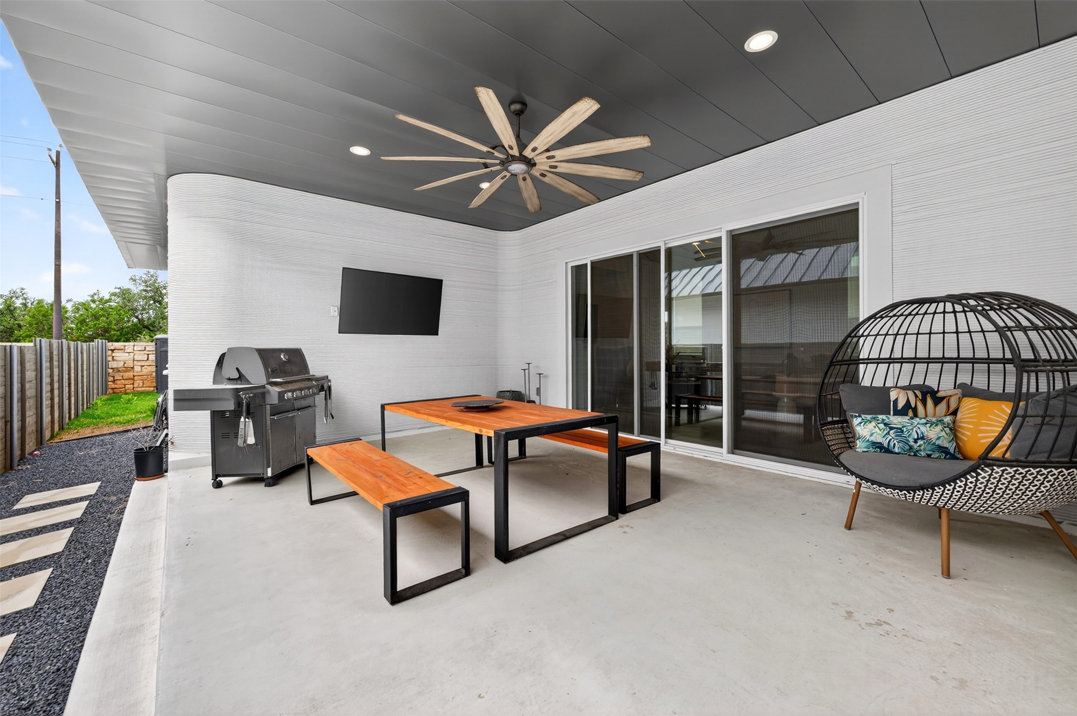 308 Painted Sunset Drive Georgetown, TX 78628 - Photo 19 of 26 Covered patio with a dark grey ceiling, recessed lighting, and a large ceiling fan