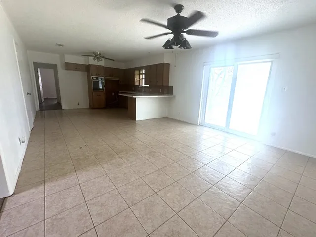 a view of a kitchen with a sink and a window