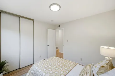 a bedroom with a bed and a table