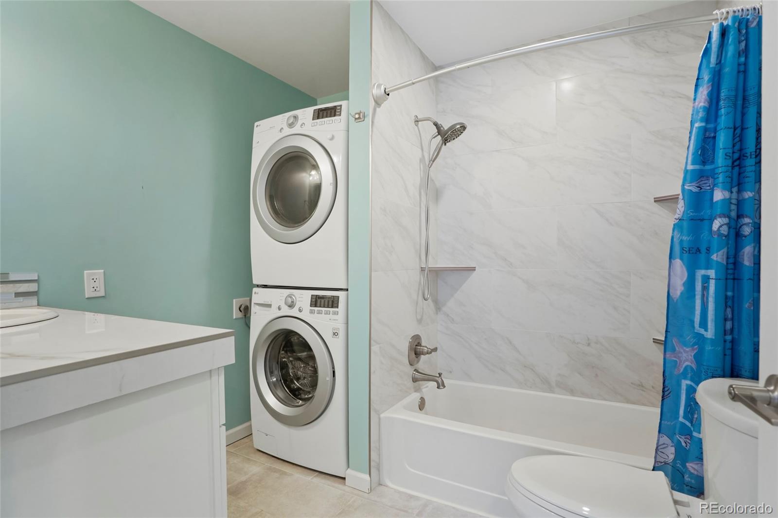 535 Howe Street Castle Rock, CO 80104 - Photo 17 of 25 a utility room with sink dryer and washer