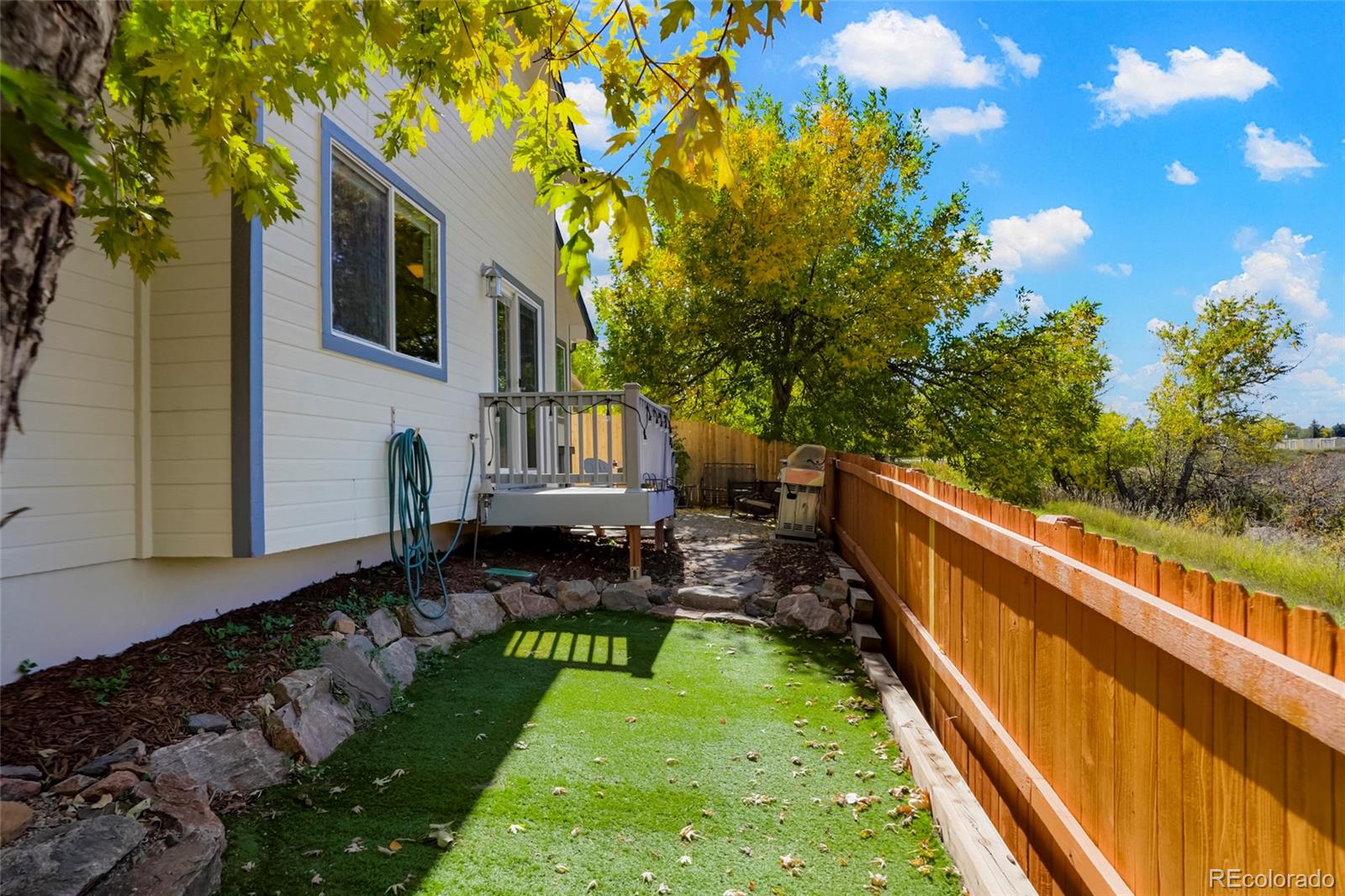 535 Howe Street Castle Rock, CO 80104 - Photo 24 of 25 a view of swimming pool with lawn chairs and a yard