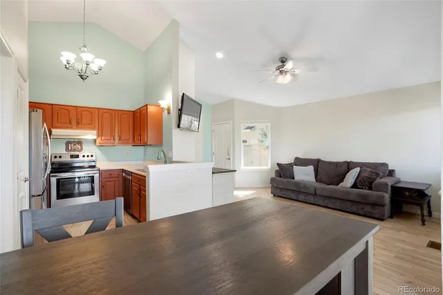 a kitchen with stainless steel appliances granite countertop a sink a stove and oven