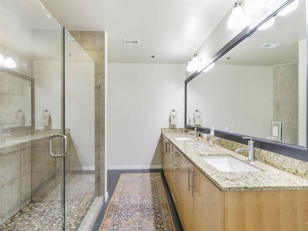 1001 Belleview Street, Unit 307 Dallas, TX 75215 - Photo 18 of 40 HUGE walk in shower and linen closet are great features in the primary bathroom