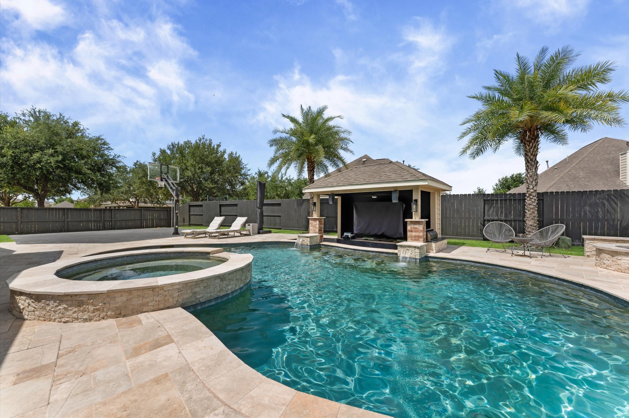 14016 Savannah Landing Lane Rosharon, TX 77583 - Photo 38 of 49 a view of a swimming pool with a patio and a garden