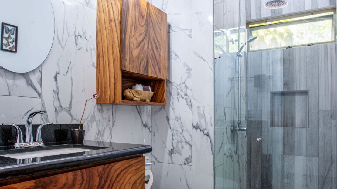 0 Modern Gem In The Natural Setting Washington, OS 20006 - Photo 17 of 33 Full bathroom featuring vanity, a marble finish shower, and tile walls