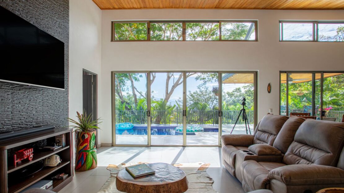 0 Modern Gem In The Natural Setting Washington, OS 20006 - Photo 3 of 33 Living room with wood ceiling, healthy amount of natural light, a towering ceiling, and tile patterned floors